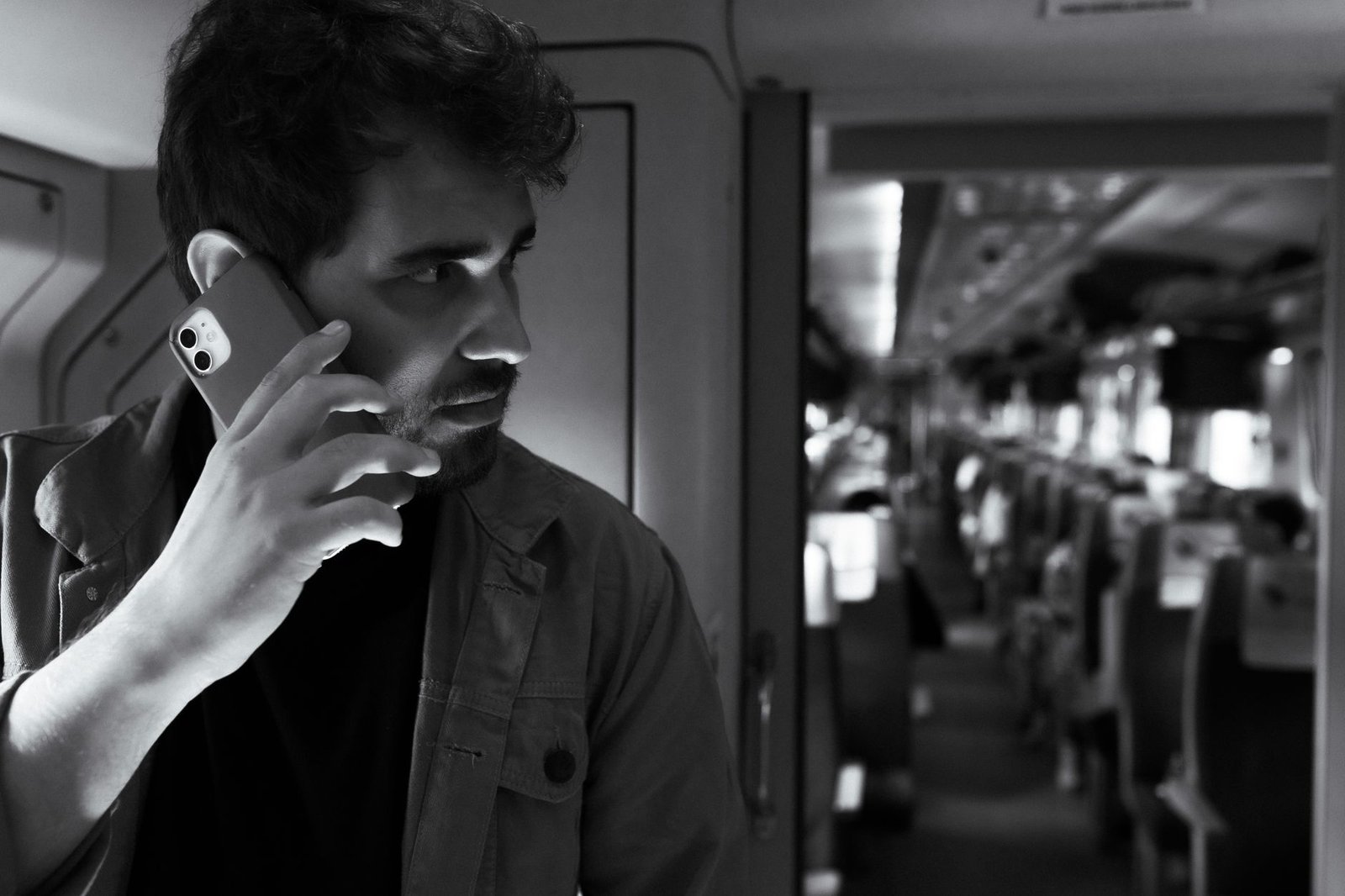 Traveler using a phone inside a Chinese high-speed railway station.
