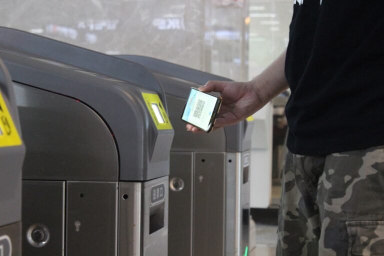 A traveler using QR-code mobile payment in China