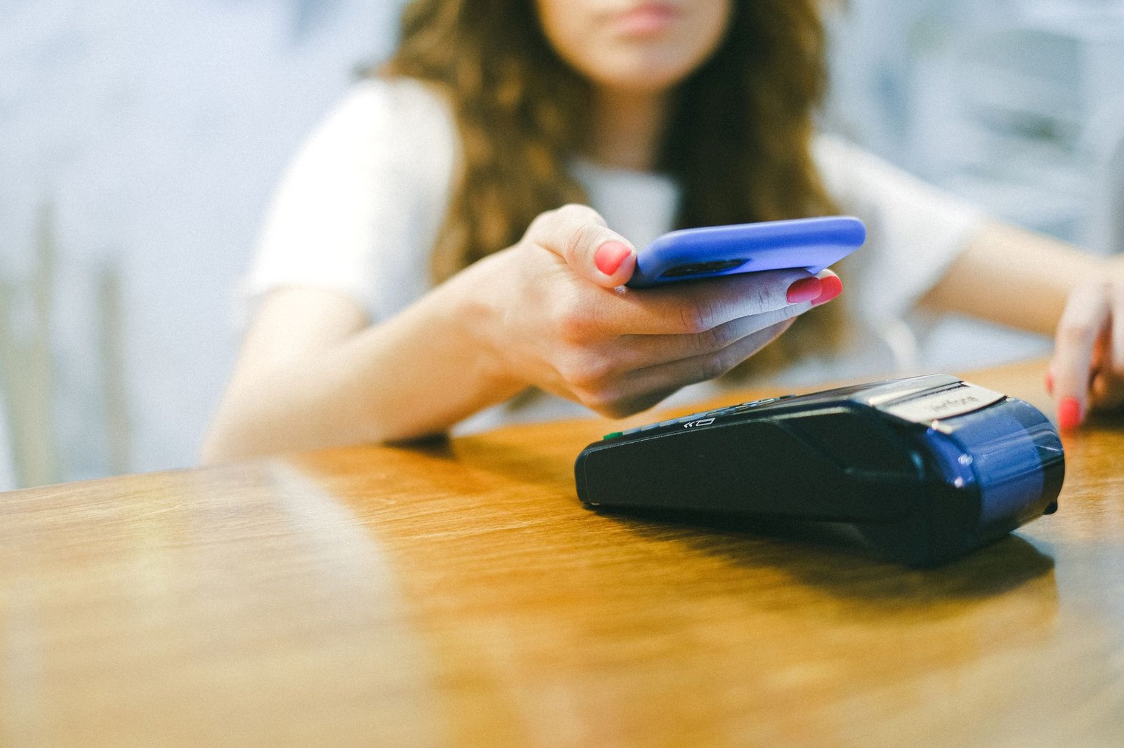 Traveler making a mobile payment at a shop in China.