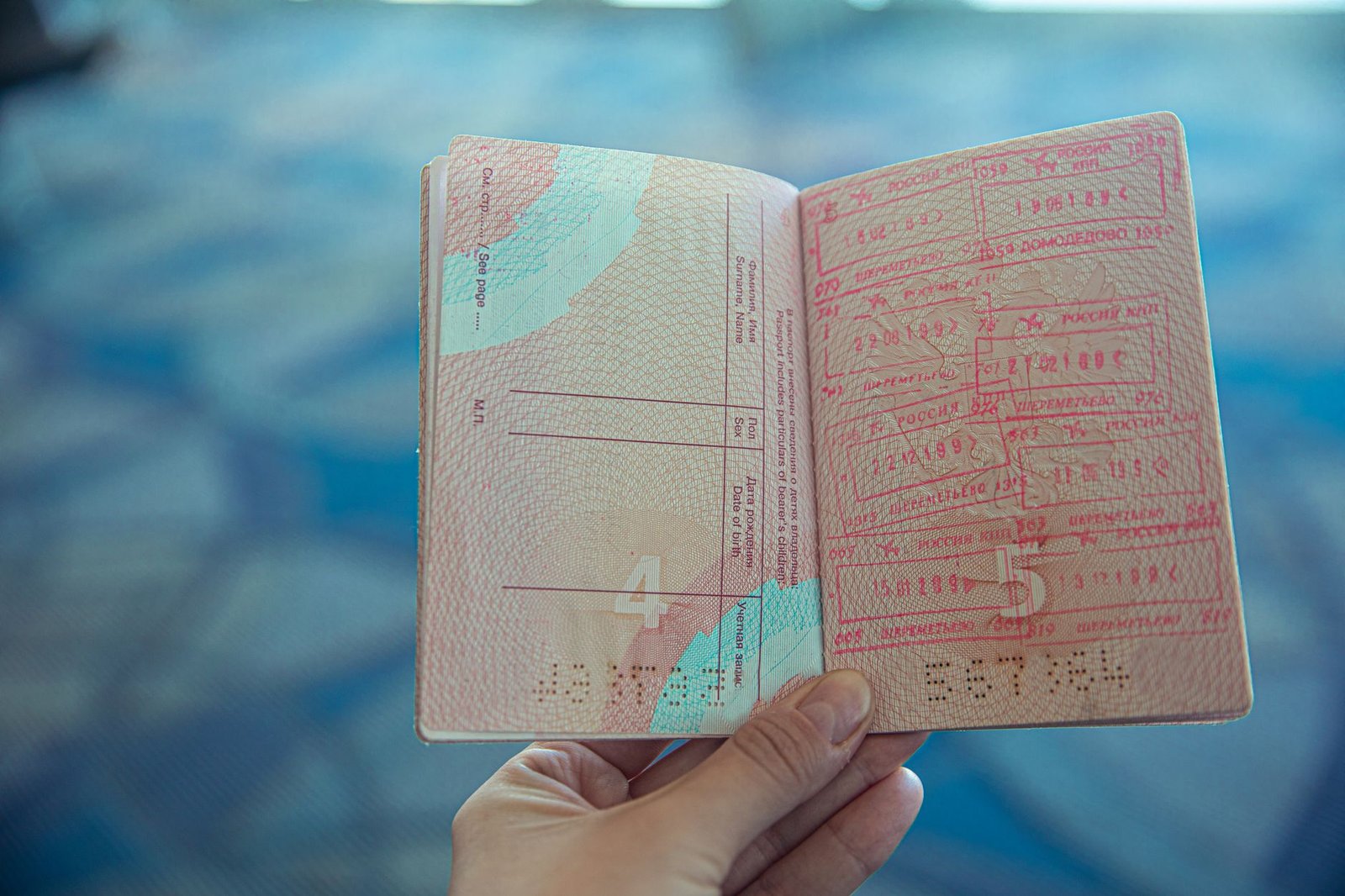 Singapore passport with travel essentials for China.