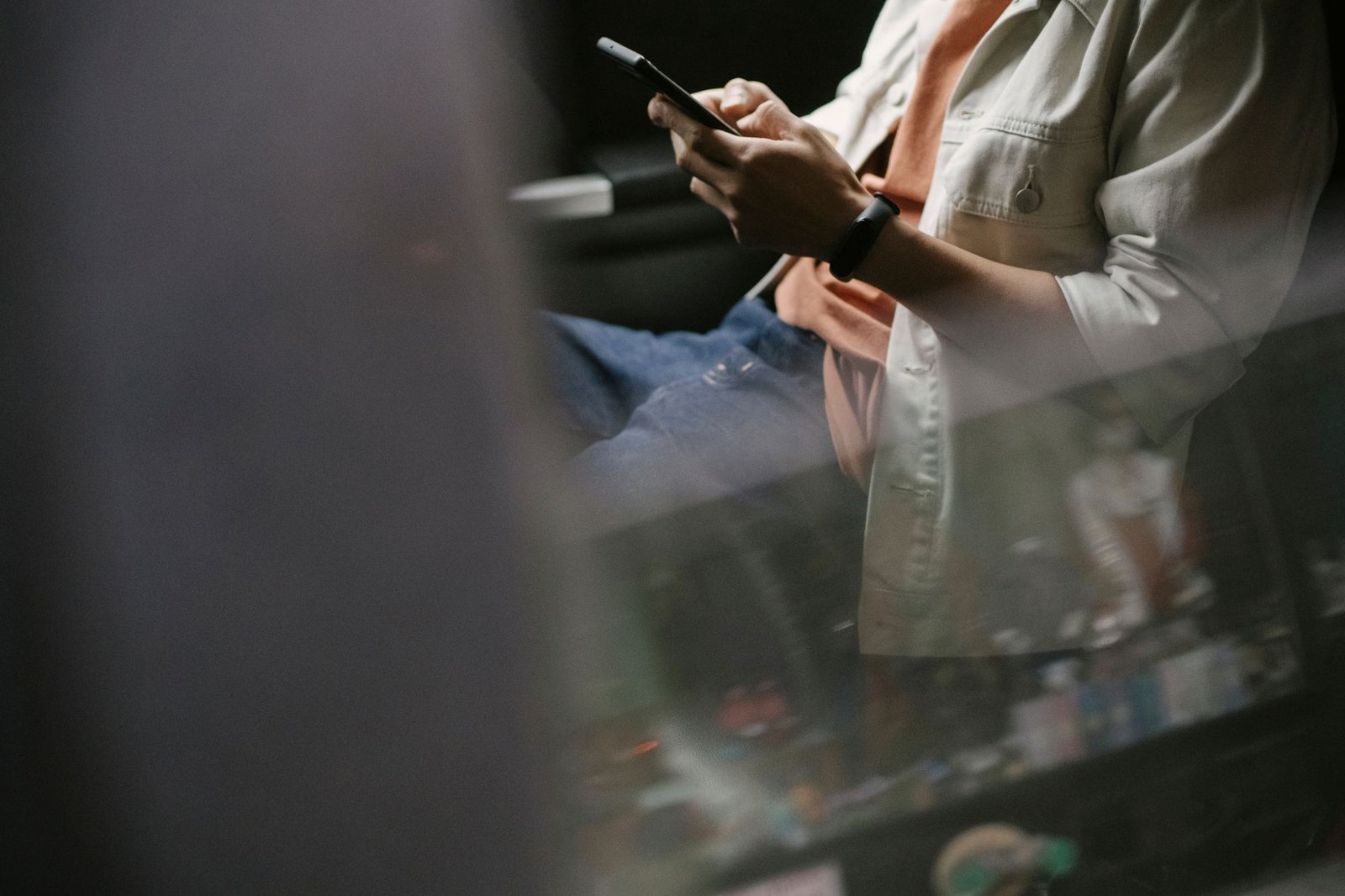 Traveler messaging on a smartphone in a Chinese city.