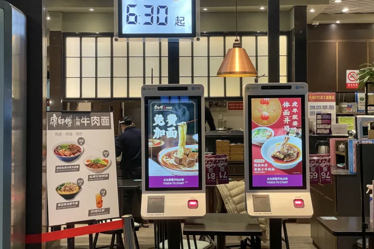 Self-service food-ordering kiosks at a Master Kong restaurant in Zhengzhou Airport