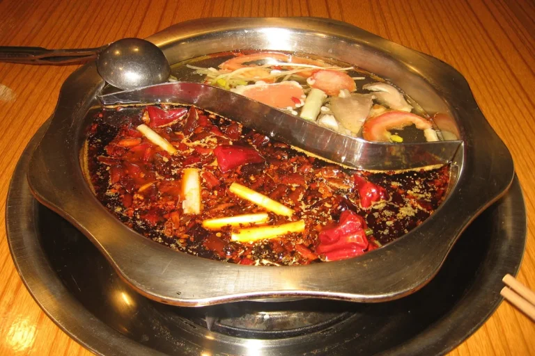 Divided Chongqing hot pot filled with spicy red broth