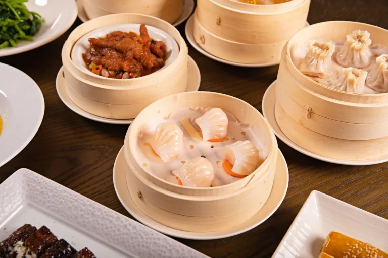 Assorted dim sum dishes served in bamboo steamers on a table