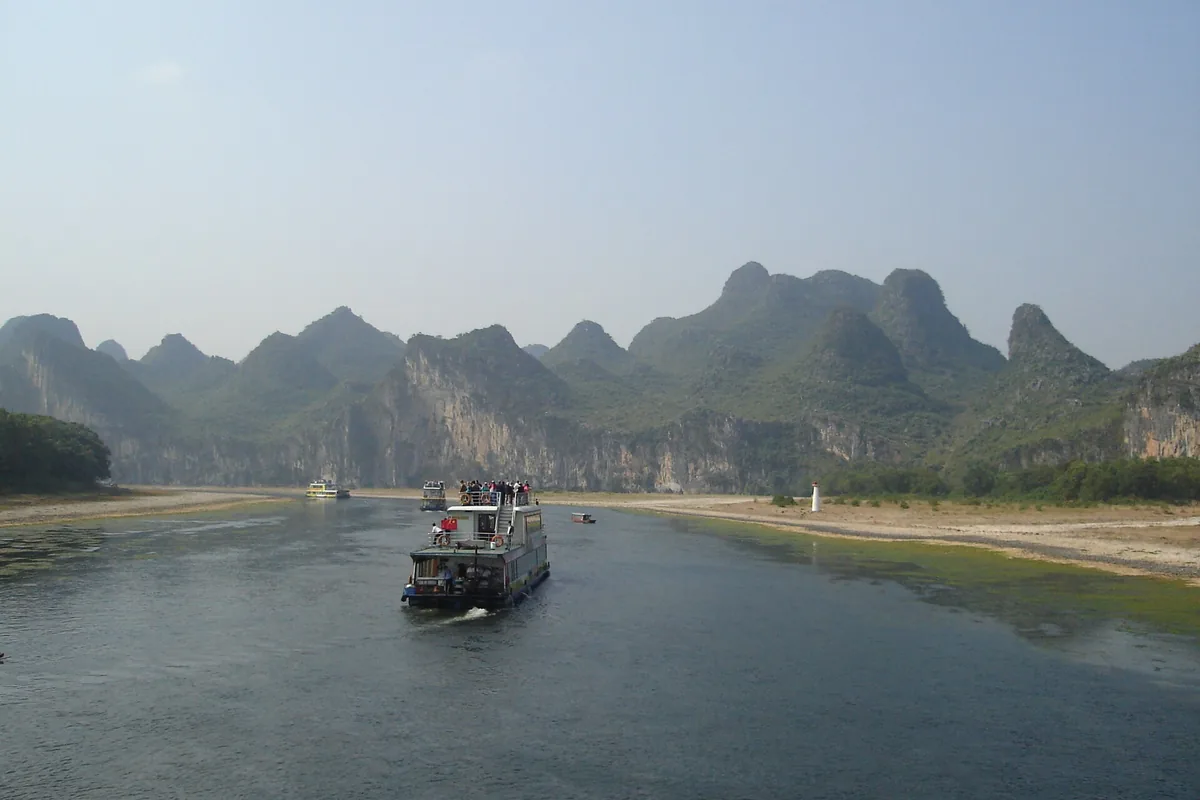 Cruise boat travelling along the Li River near Guilin