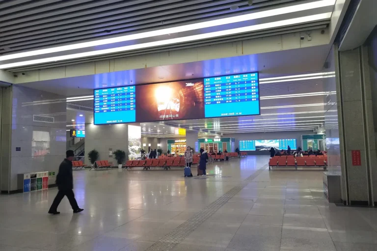 Concourse and departure boards inside Beijing North Railway Station
