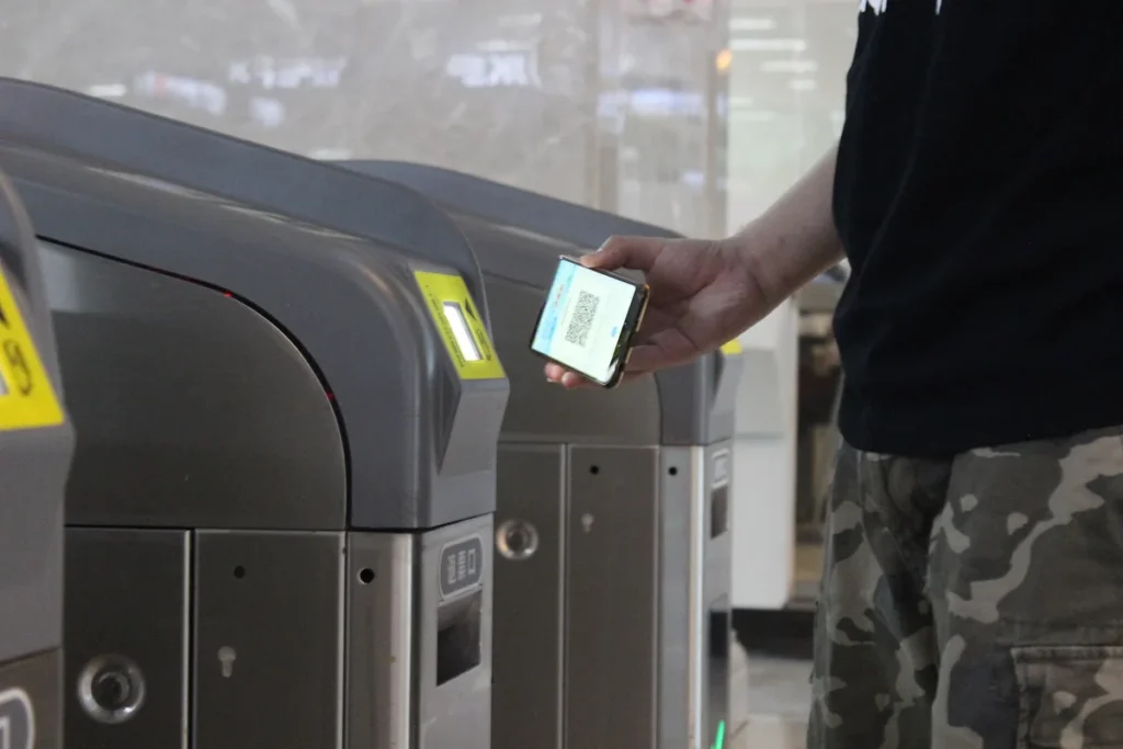 Passenger using a mobile ticket at a Wuhan Metro gate
