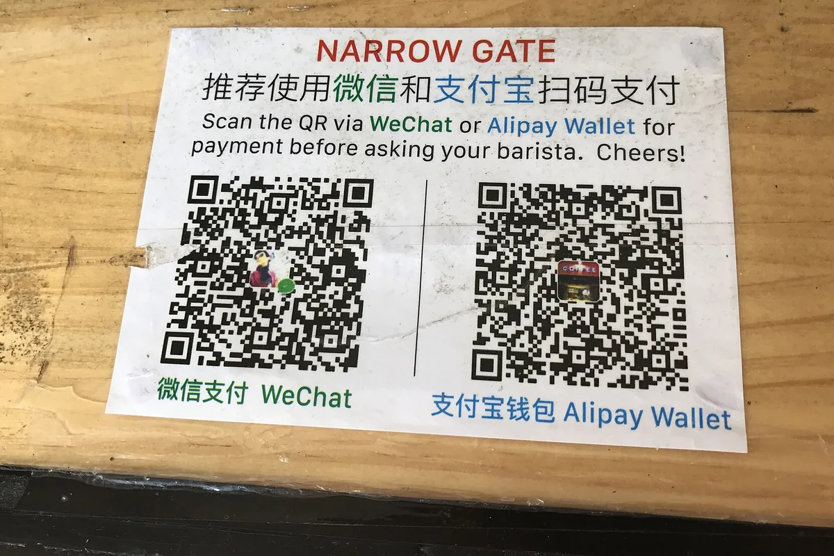 WeChat Pay and Alipay payment signs at a China business