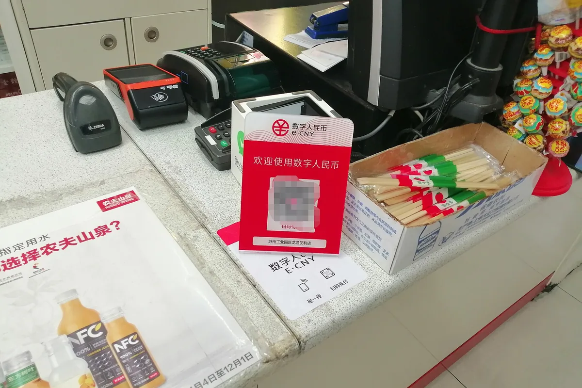 Digital payment sign beside a checkout counter in China