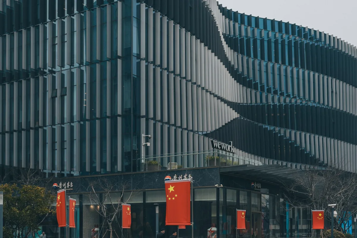 Modern government building with Chinese flags