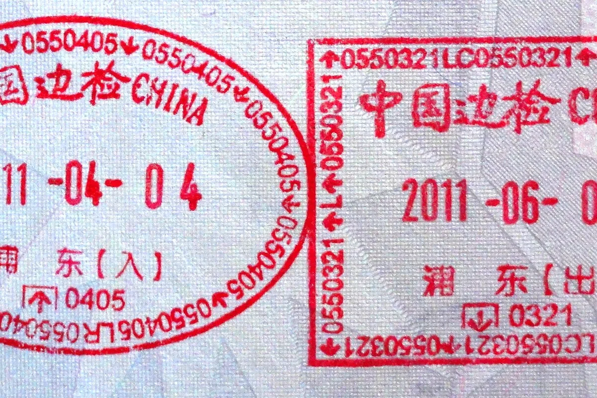 China visa and immigration stamp in a passport