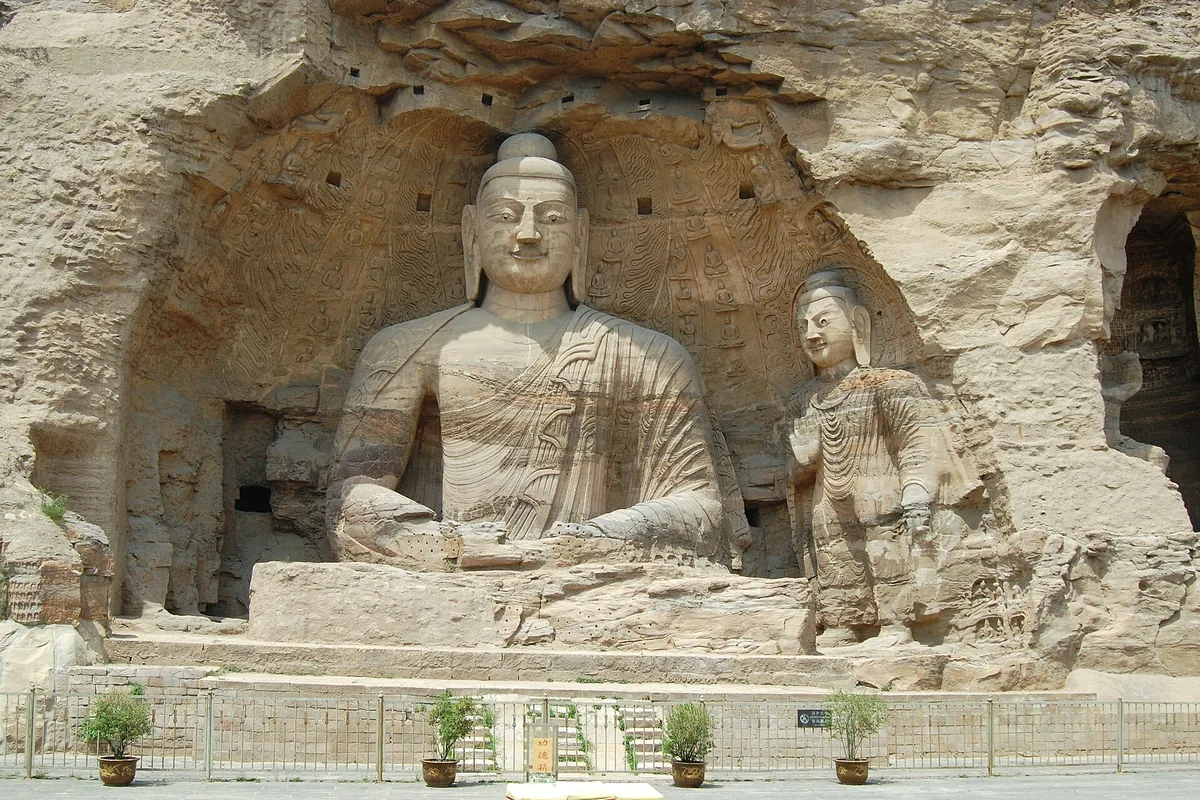 Large seated Buddha carved into the cliff at Yungang