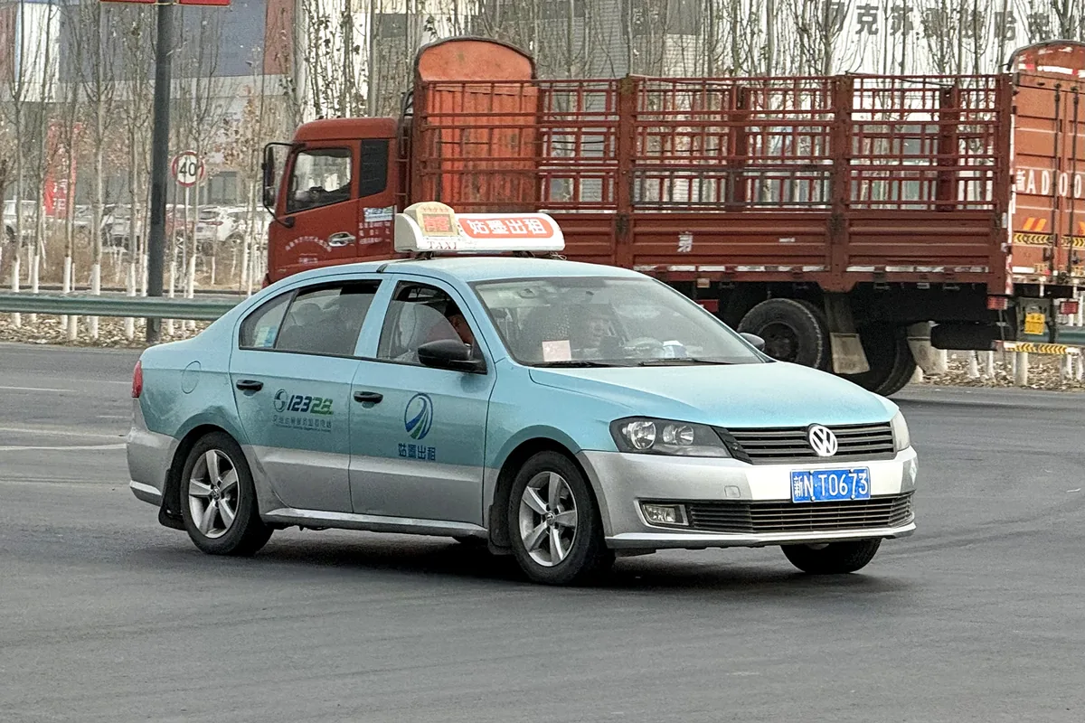 Taxi on a street in Aksu, Xinjiang