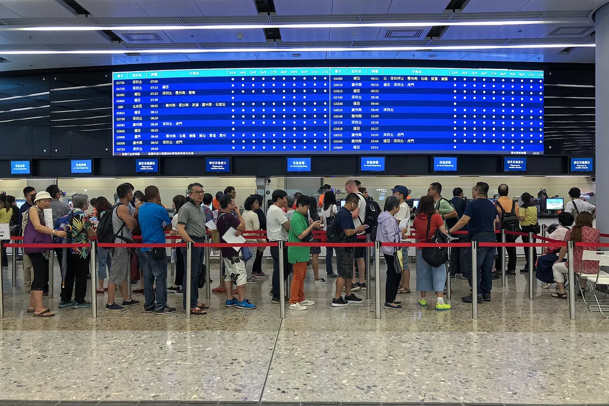 Ticket counters and departure board at Hong Kong West Kowloon Station