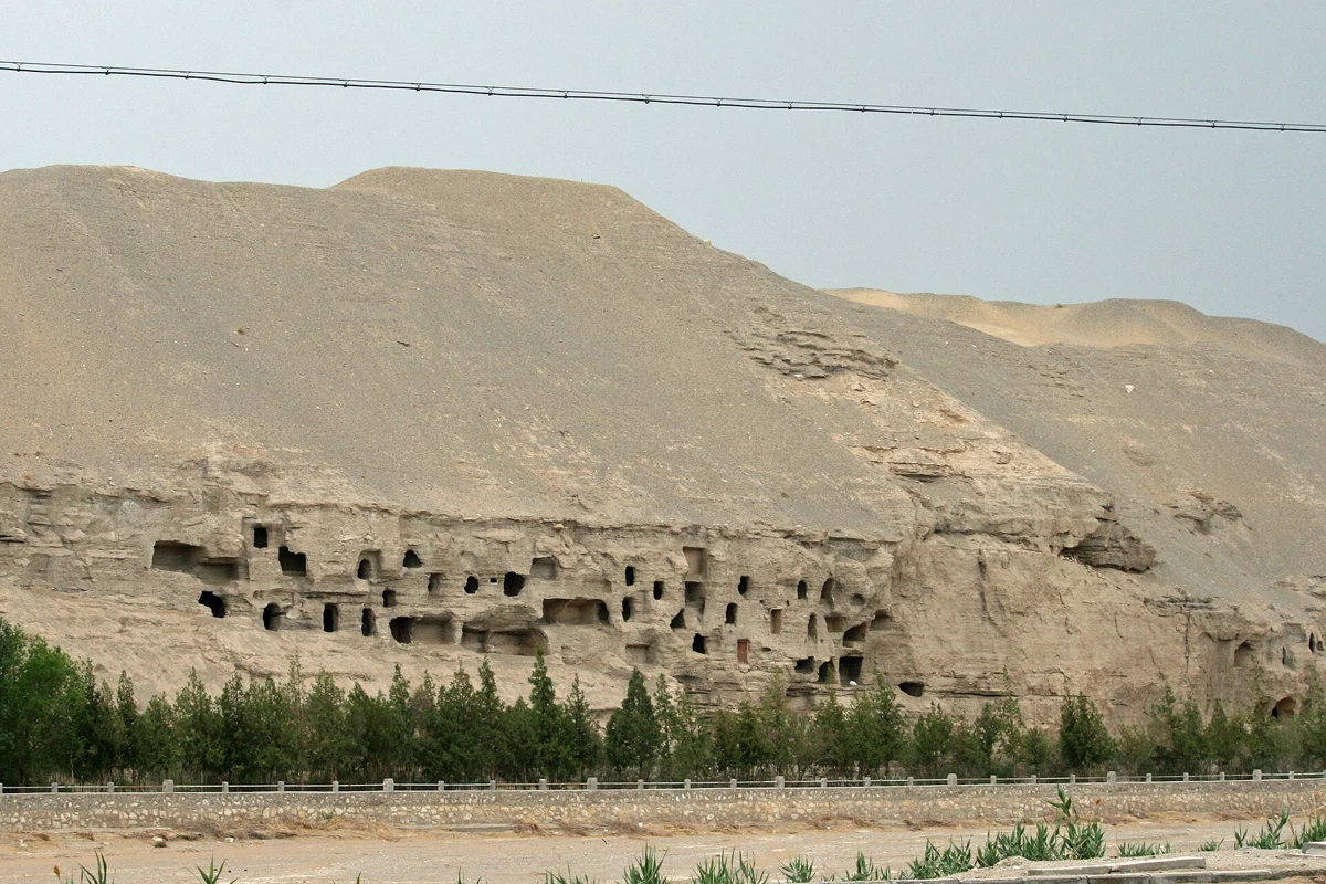 Exterior cliff face and chambers of the Mogao Caves near Dunhuang