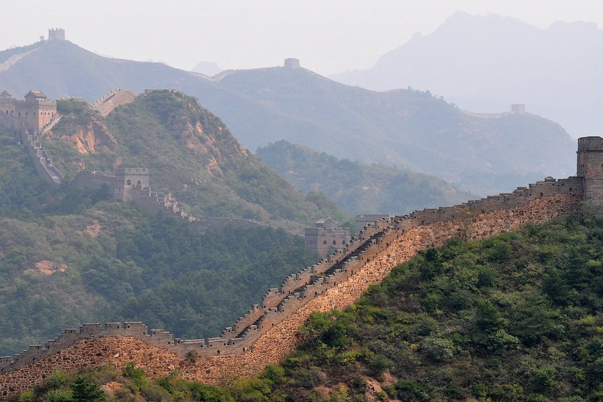The Great Wall at Jinshanling stretching across green mountains