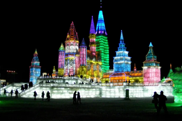 Illuminated ice palace at Harbin Ice and Snow World at night
