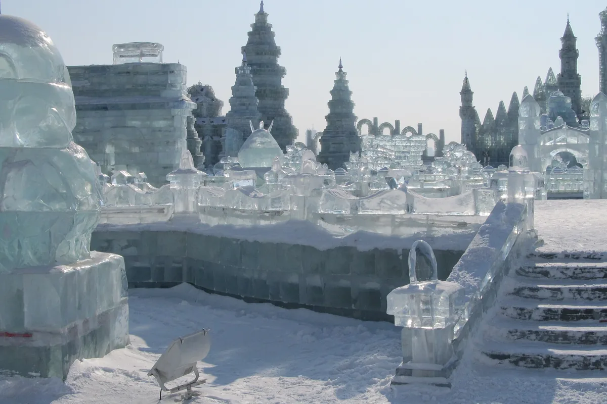 Ice sculptures and pagoda forms at Harbin Ice and Snow World in daylight