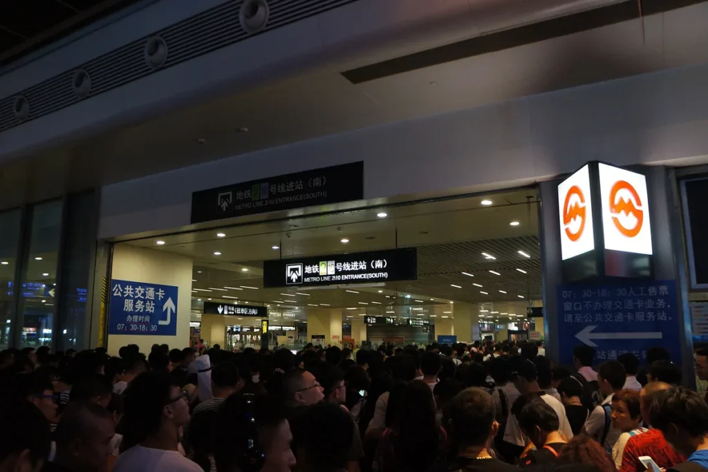 Crowds outside the metro entrance at Shanghai Hongqiao Railway Station