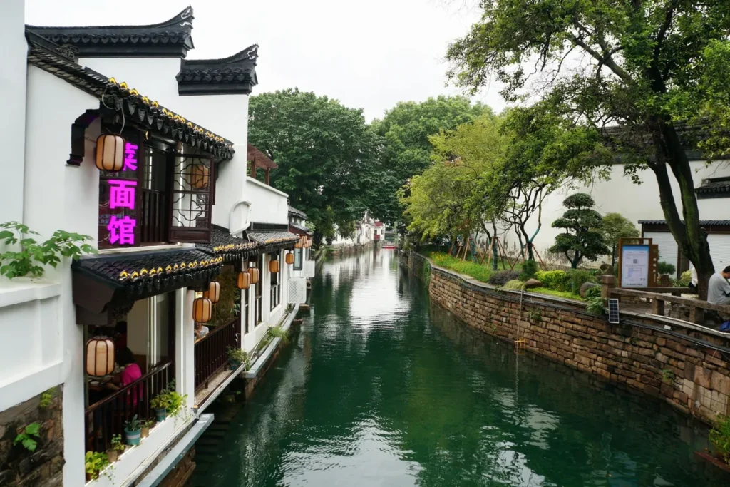 Canal beside whitewashed houses in Suzhou, Jiangsu