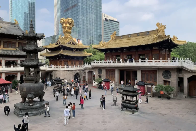 Jing'an Temple courtyard with gold-roofed halls and Shanghai skyscrapers
