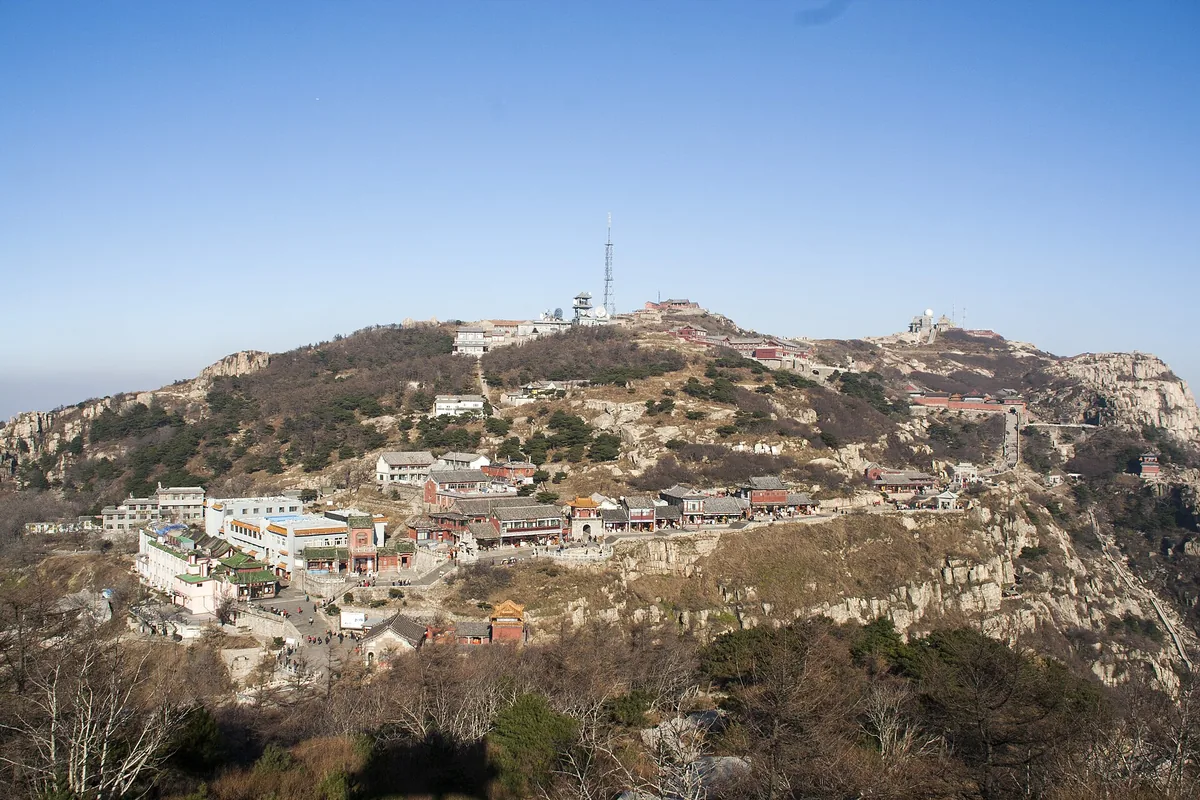 Summit buildings and surrounding mountain ridges on Mount Tai