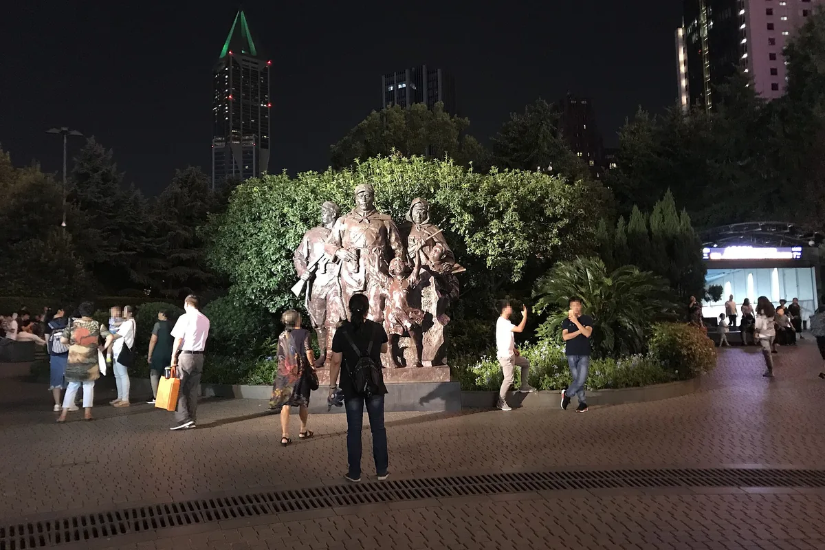 People's Square at night near a metro entrance