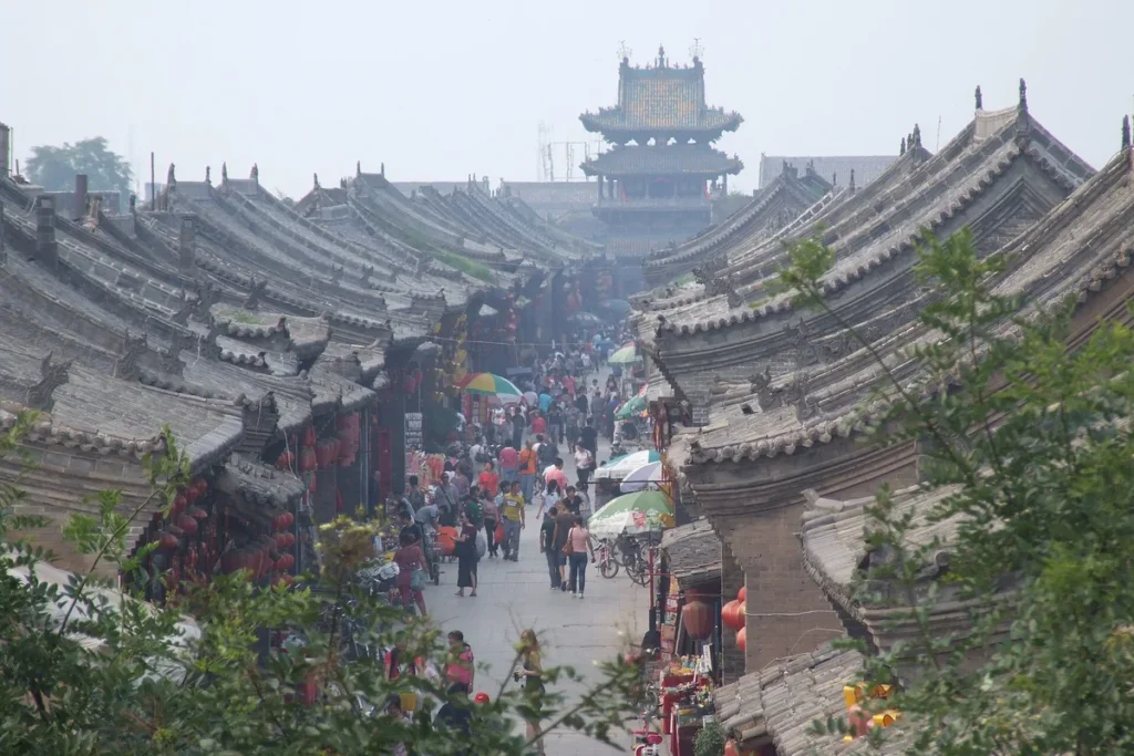 Historic rooftops and a busy pedestrian street in Pingyao Ancient City