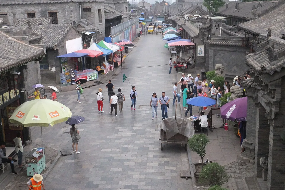 Stone-paved lane and courtyard buildings inside Pingyao Ancient City