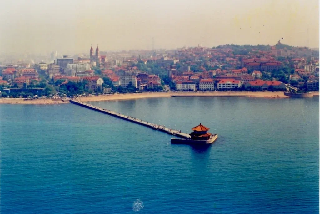 Aerial view of Zhanqiao Pier and Qingdao's red-roof old city
