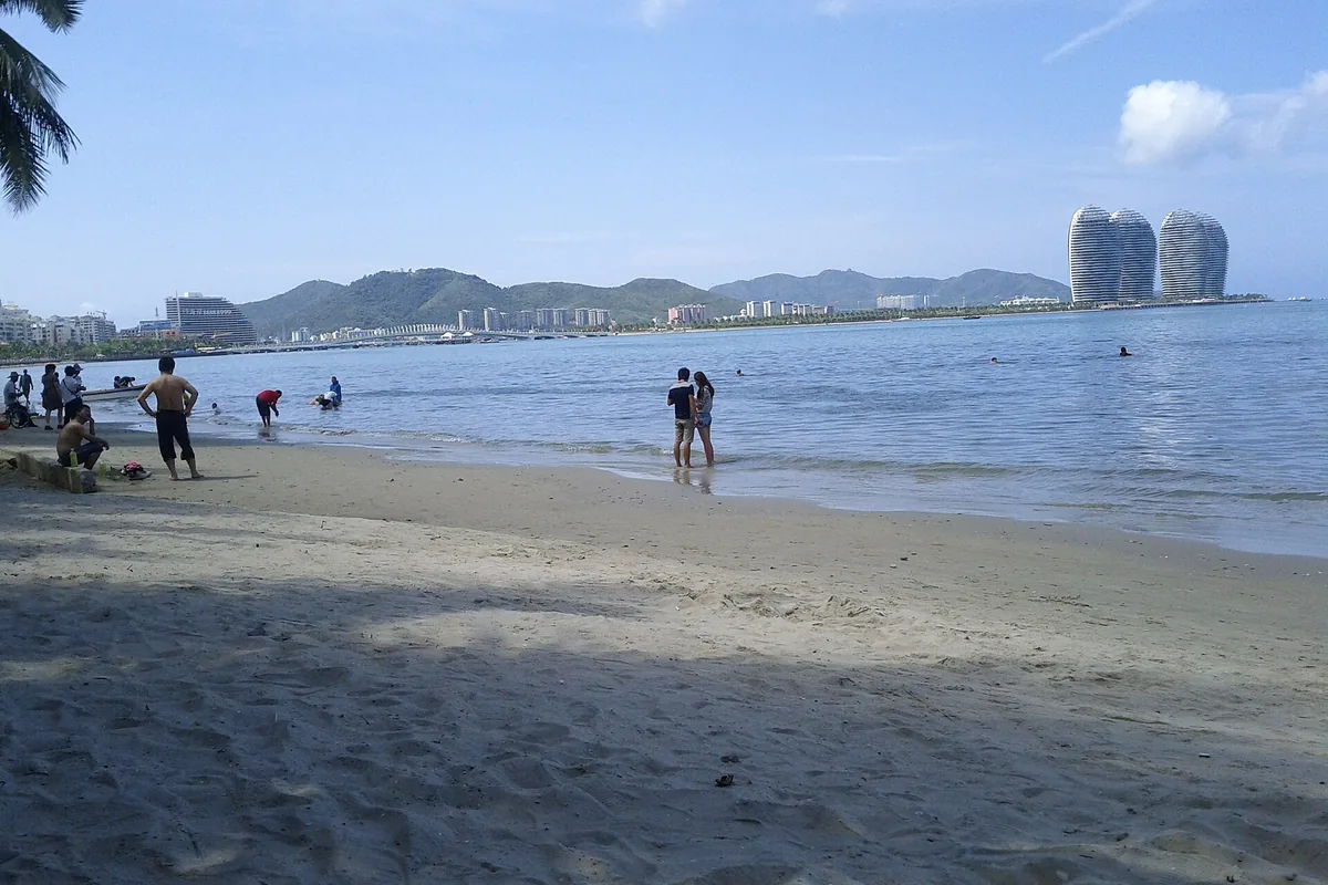 Sandy beach and tropical shoreline in Sanya, Hainan