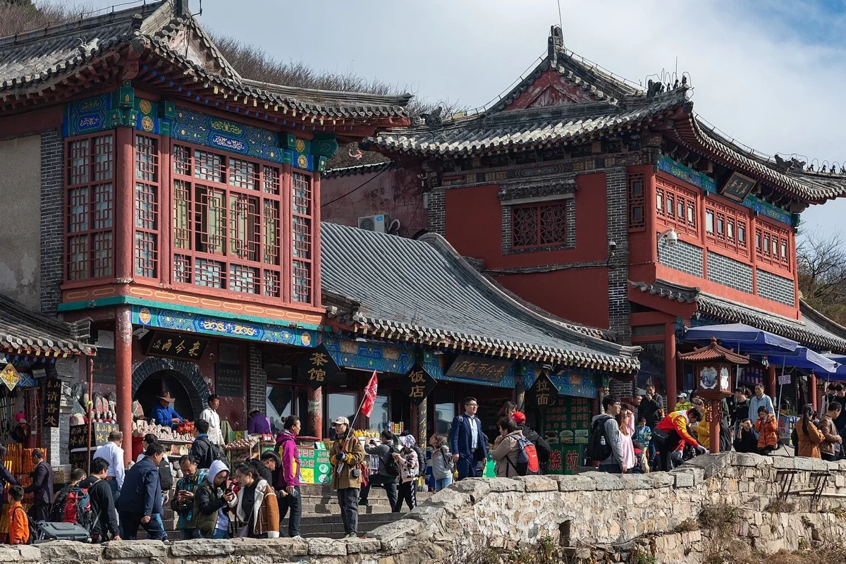 Traditional buildings and visitors on Heaven Street at Mount Tai