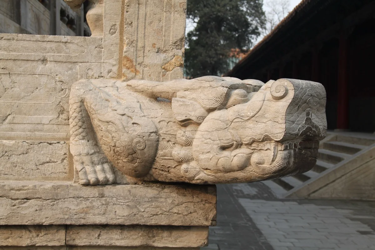 Carved stone guardian detail at the Temple of Confucius in Qufu