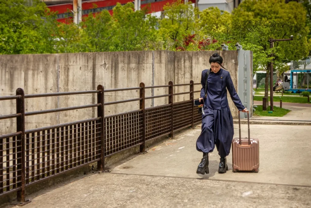 Traveller walking with a suitcase in an urban Shanghai setting