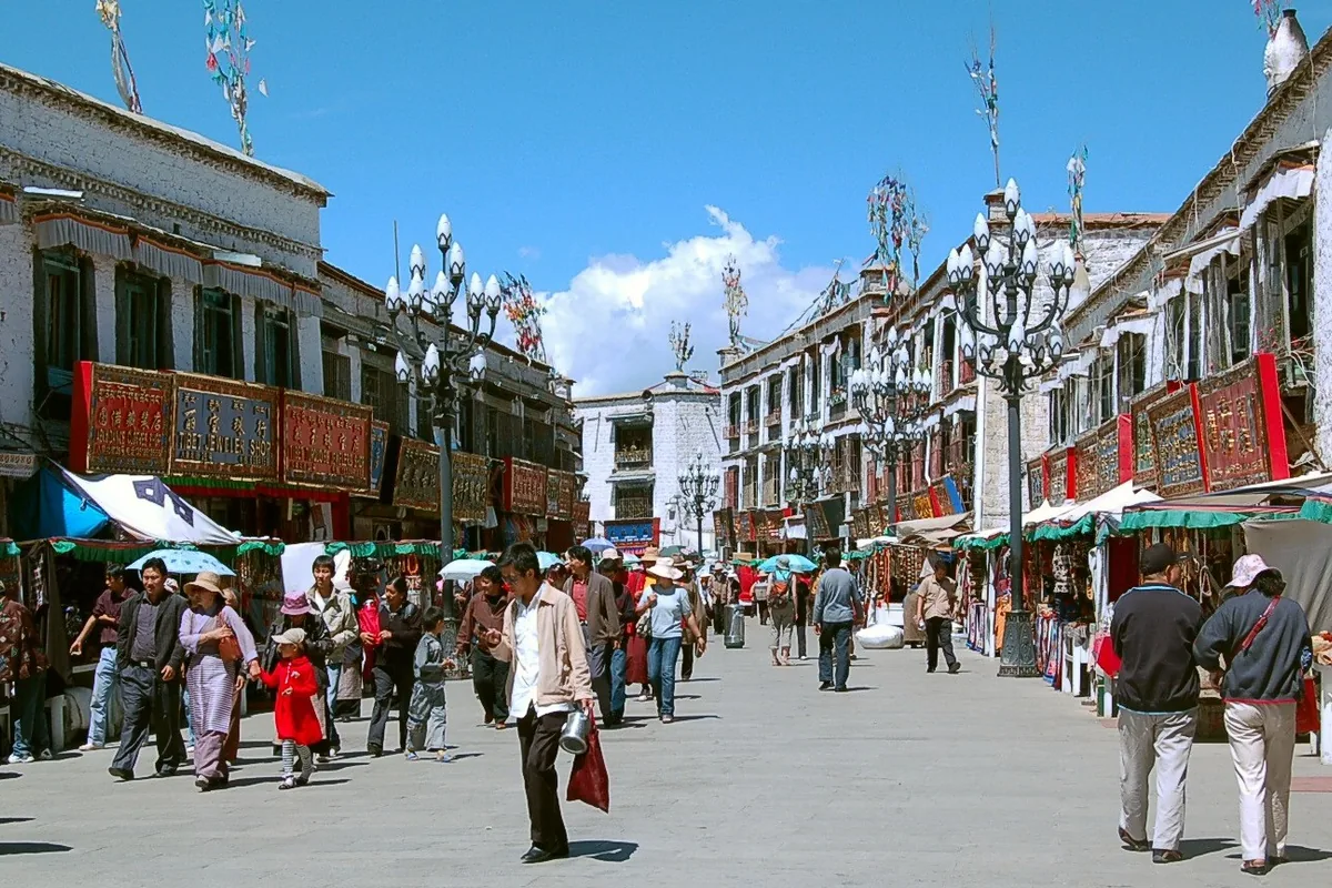 Travelers and residents walking through Barkhor in Lhasa