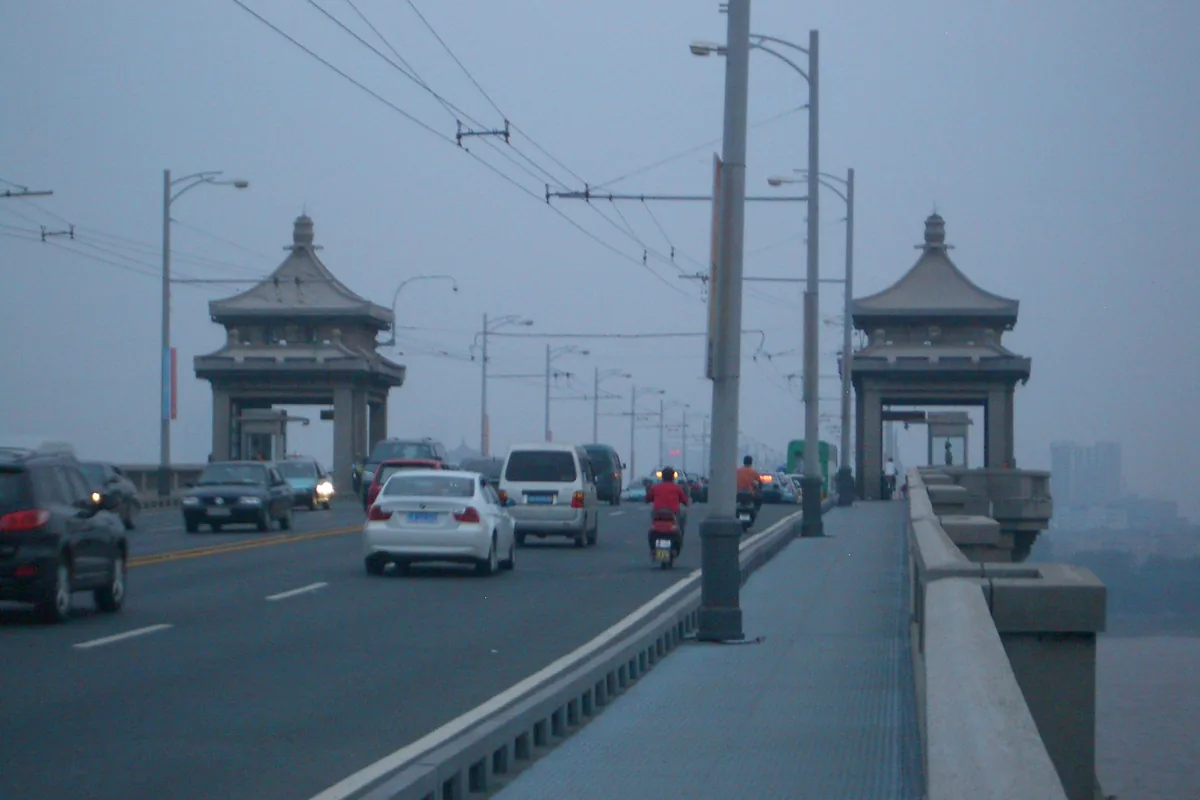 Road traffic passing the gateway towers on Wuhan Yangtze River Bridge